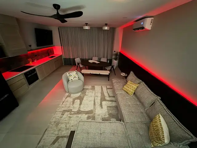 3 Bedroom Ocean View Sunset Villas 7 a living room with a couch and a table