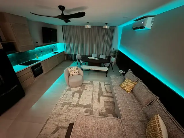 3 Bedroom Ocean View Sunset Villas 6 a living room with a couch and a table